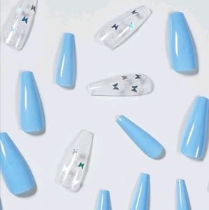 Blue press-on nails with butterfly accents